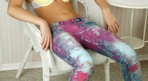 Miguela A Delicious Miguela A strips her colorful jeans and poses sensually